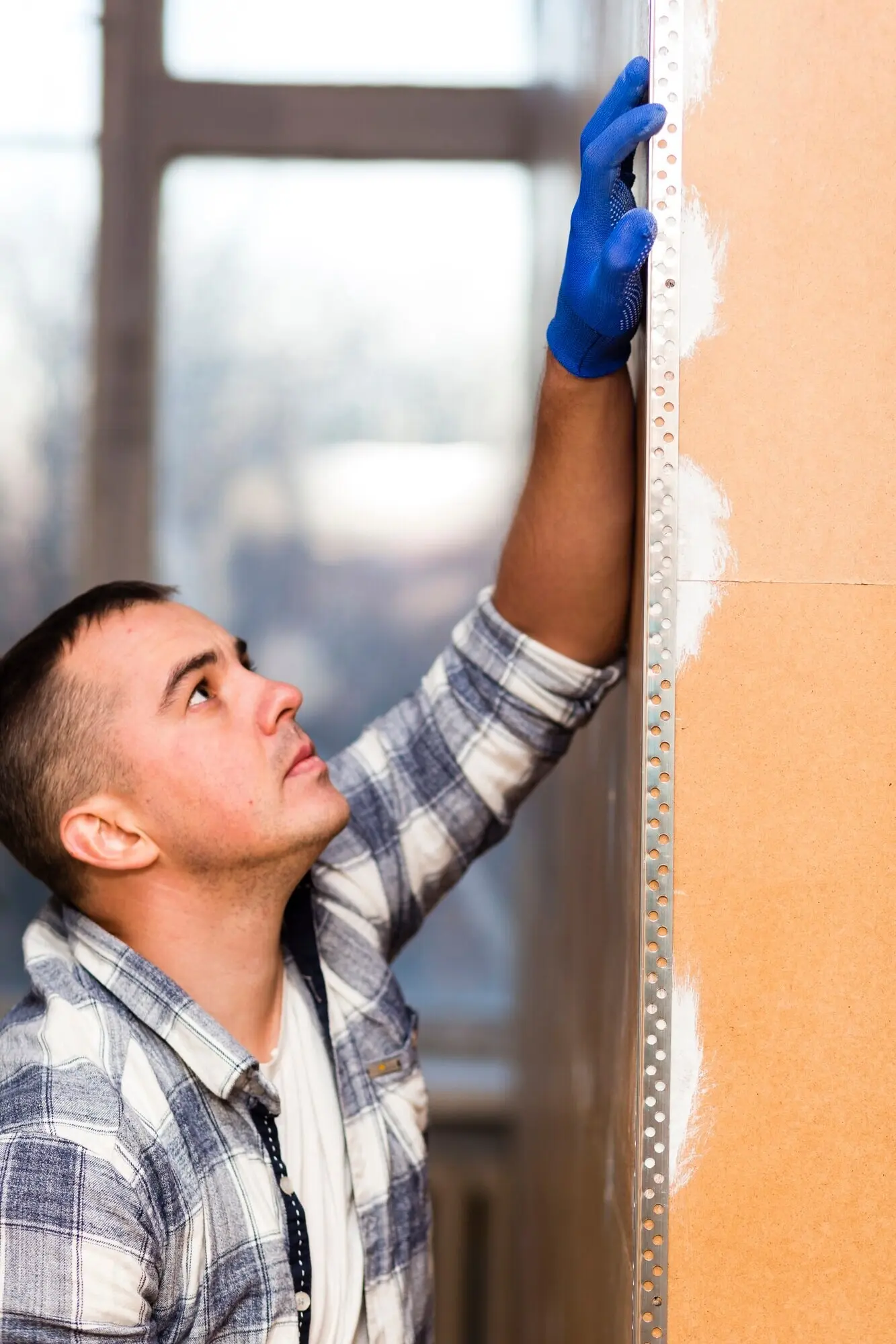 Front-facing view of a man working in construction.